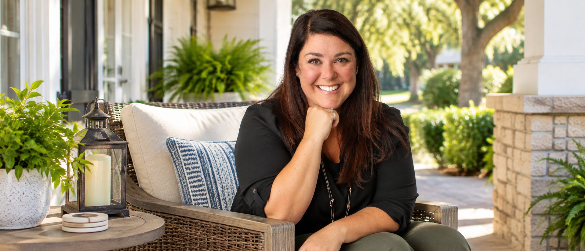 Jill Wood seated on a welcoming Northwest Florida porch